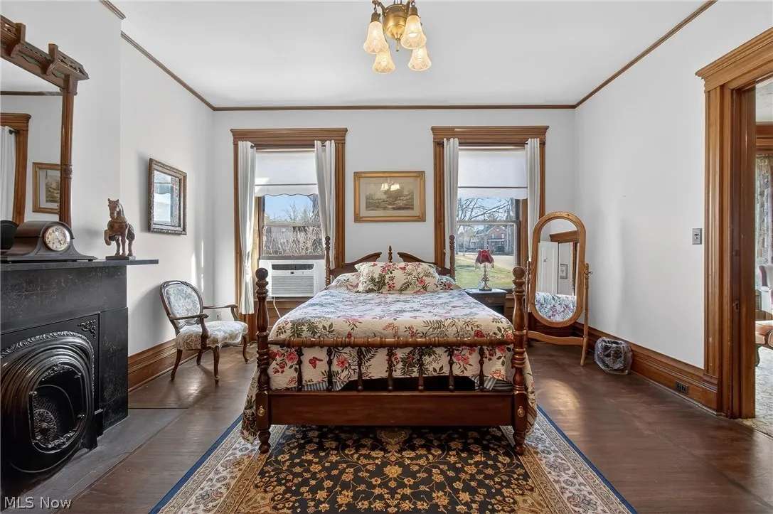 Four-poster bed beside a fireplace in a bedroom at the Thomas H. Russell House